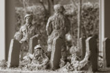 25. Soldier (right) reading his own tomb stone